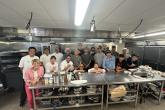  Hook to Plate workshop attendees pose for a photo with Chef Mavro and Brooks Takenaka. 