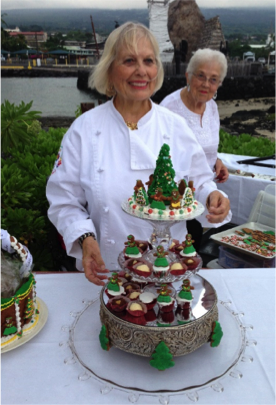Chef posing with desserts