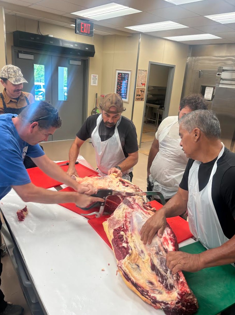 Instructor Bill Wong teaches Hawai‘i Community College butchery students proper beef cutting techniques. (Photo Credit: Hawai‘i CC)